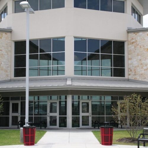 Exterior View of Glass Curtain Wall System Above Storefront Entrance Doors | Lake Travis Middle School | Commercial Projects | Anchor-Ventana