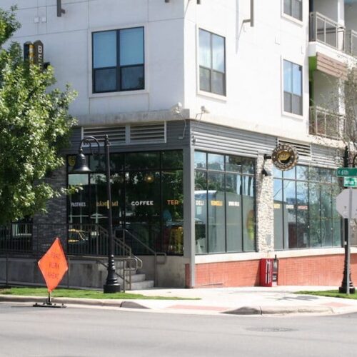 Corner View of Local Business Storefronts on Lower Level of Building Exterior | Corazon Apartments | Commercial Projects | Anchor-Ventana