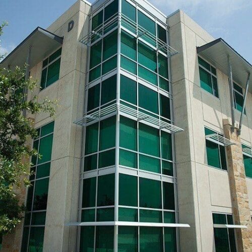 Exterior Corner View of Building with Curtain Wall Systems & Windows with Sunshades | LCRA Office Buildings | Commercial Projects | Anchor-Ventana Glass