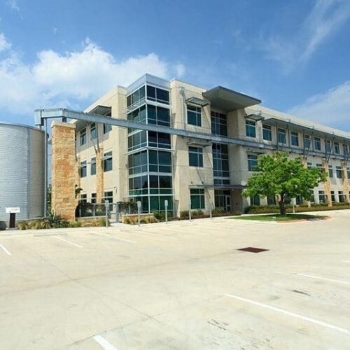 Exterior Corner View of Curtain Wall System, Storefront Entrance Doors & Sunshades | LCRA Office Buildings | Commercial Projects | Anchor-Ventana Glass