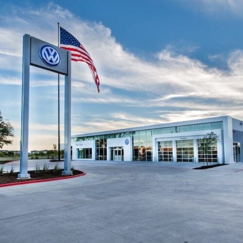 Exterior View of Glass Curtain Wall System & Storefront Entrance | Onion Creek Volkswagen | Commercial Projects | Anchor-Ventana Glass