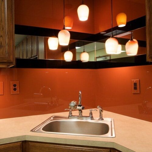 Back Painted Glass & Mirror Backsplash with Outlet Covers in kitchen | Colored Glass Gallery | Residential Products | Anchor-Ventana Glass