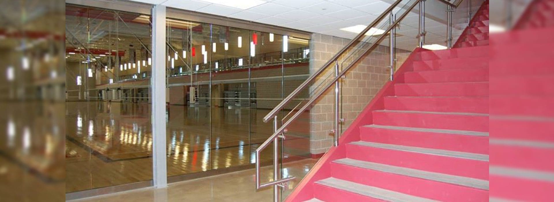 3/4" Impact Resistant Glass Wall at Court Level and Glass Handrail | Commercial Glass Handrail Products | Commercial Products | Anchor-Ventana Glass