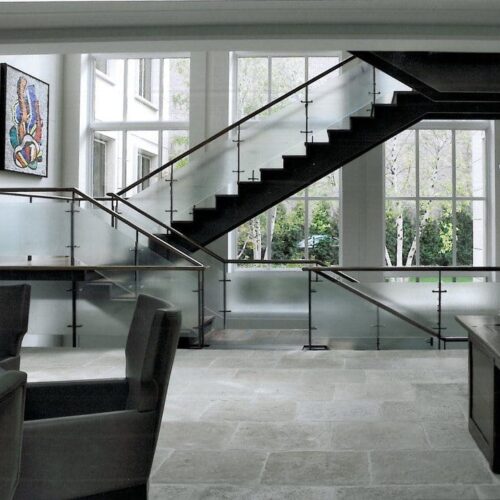 Saten Glass Handrail set with Standoff Caps in Stairway | Glass Handrail Systems | Residential Gallery | Anchor-Ventana Glass