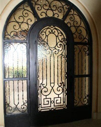 Flemish Glass Set in Custom Wrought Iron Entry Door & Sidelights | Glass Wall Systems Gallery | Residential Products | Anchor-Ventana Glass