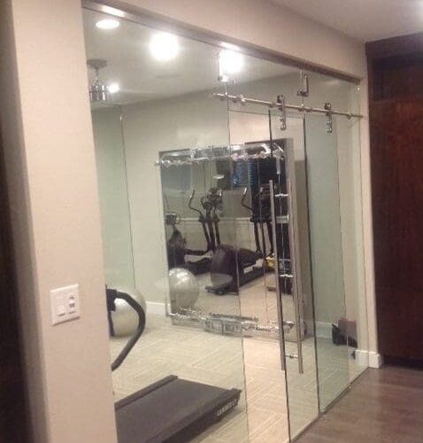 Dorma Manet Sliding Doors and Wall at Gym Room | Glass Wall Systems Gallery | Residential Products | Anchor-Ventana Glass