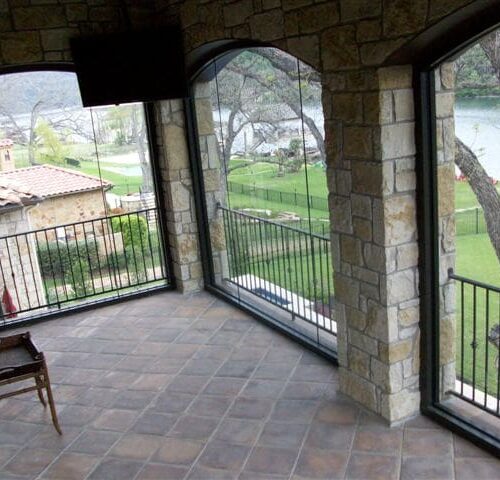 Arched Butt Glazed Windows on Enclosed Balcony | Glass Wall Systems Gallery | Residential Products | Anchor-Ventana Glass