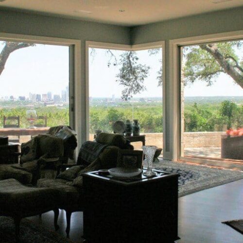 Frameless Corner Butt Glazed Window Separating Living room & Patio | Glass Wall Systems Gallery | Residential Products | Anchor-Ventana Glass