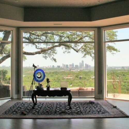 Butt Glazed Window Looking from Living Room to Balcony with Post System Glass Handrail | Glass Wall Systems Gallery | Residential Products | Anchor-Ventana Glass