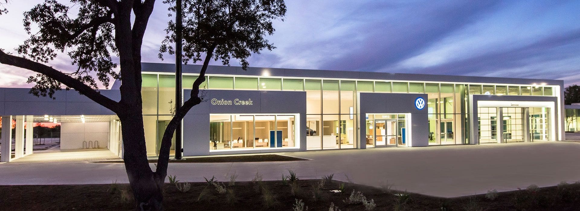 Commercial Glass | Glass Wall Systems | Onion Creek Volkswagen Dealership