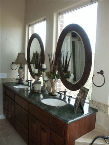 Framed Oval Mirrors Set on Windows with Drilled Standoffs in Bathroom | Mirrors Gallery | Anchor-Ventana Glass