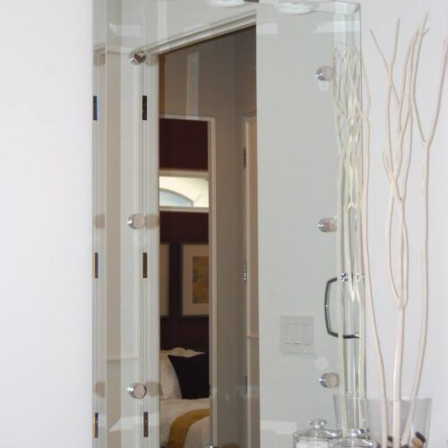 Beveled Frameless Mirror set with Standoff Caps in Powder Bath | Mirrors Gallery | Anchor-Ventana Glass