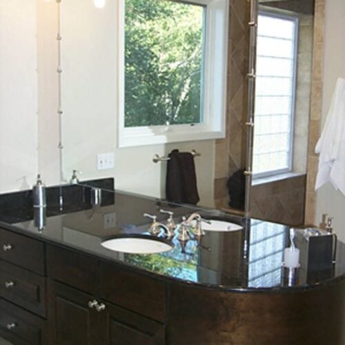 Frameless Vanity Mirror Suspended with Cable System in Bathroom | Mirrors Gallery | Anchor-Ventana Glass