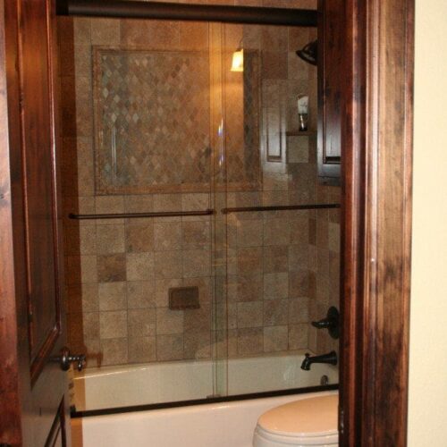 Frameless Sliding Tub Shower Enclosure in Bathroom | Shower Gallery | Anchor-Ventana Glass