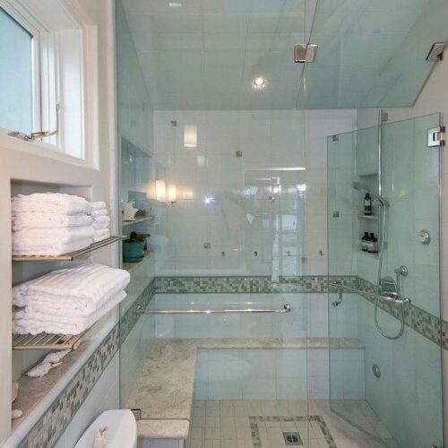 Unique frameless glass shower door and walls in contemporary bathroom | Shower Gallery | Anchor-Ventana Glass