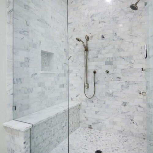 Frameless Notched Fixed Panel Set with Clamps in Bathroom | Shower Gallery | Anchor-Ventana Glass