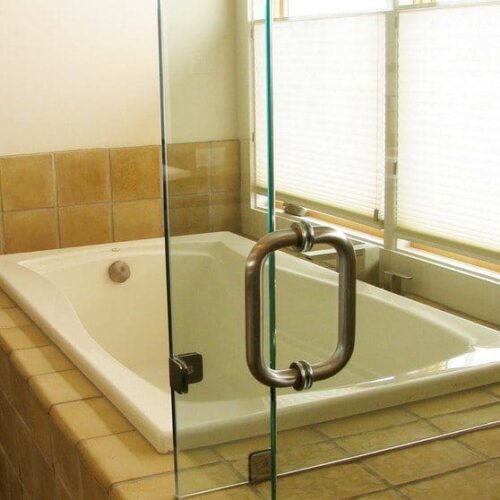 Frameless Corner Shower Enclosure with Clamps at Fixed Panels in Bathroom | Shower Gallery | Anchor-Ventana Glass